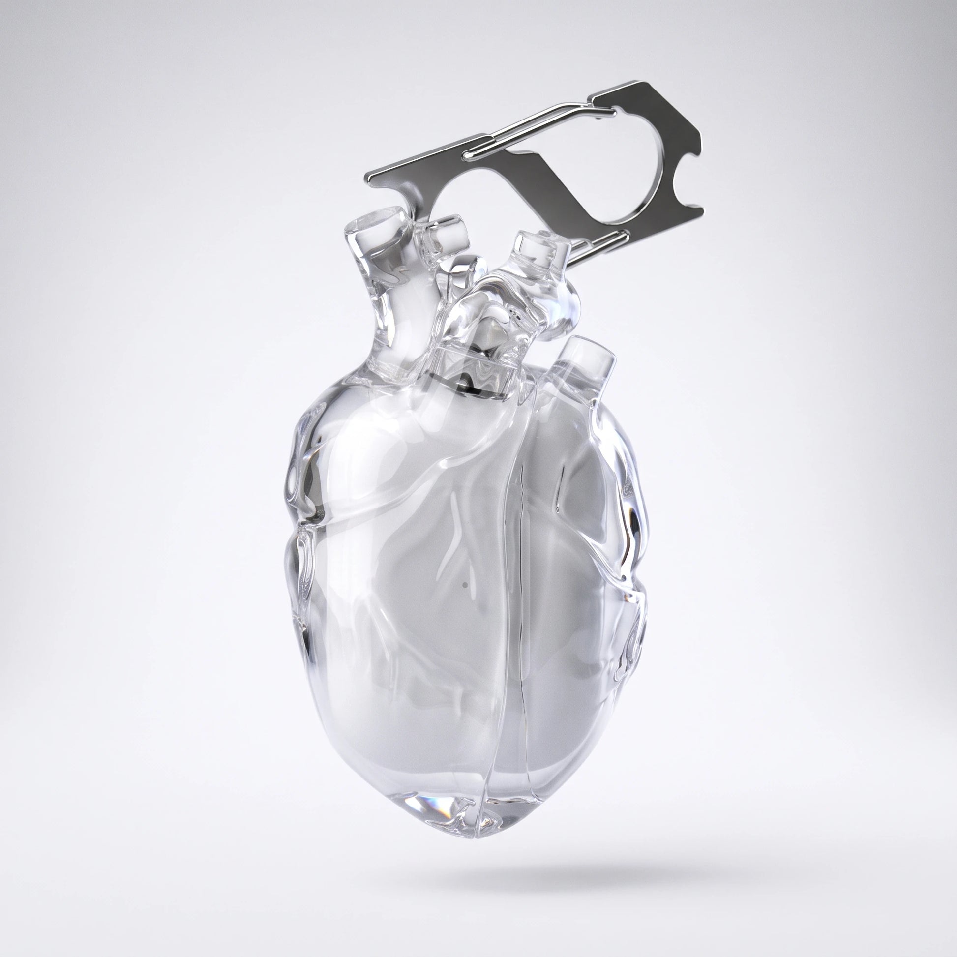 Clear anatomical heart AirPods case with its steel carabiner on white